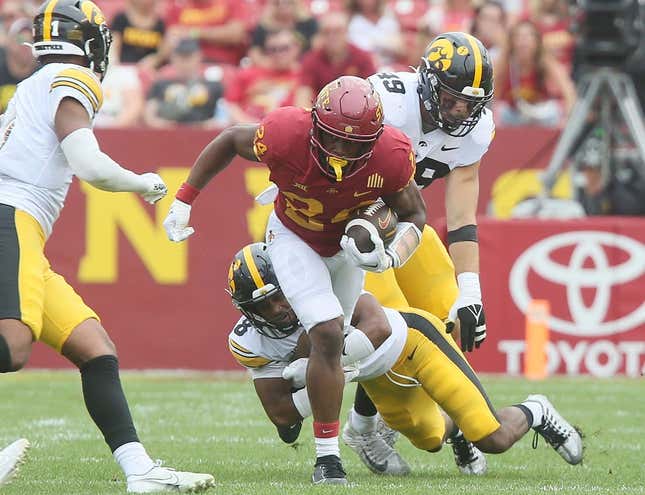 Iowa State Cyclones running back Abu Sama (24) breaks a tackle from Iowa Hawkeyes&#39; defensive back Deshaun Lee (8) and Iowa Hawkeyes defensive line Yahya Black (94) during the second quarter of the Cy-Hawk football game at the Jack Trice Stadium on Saturday, Sept. 9, 2023, in Ames, Iowa.