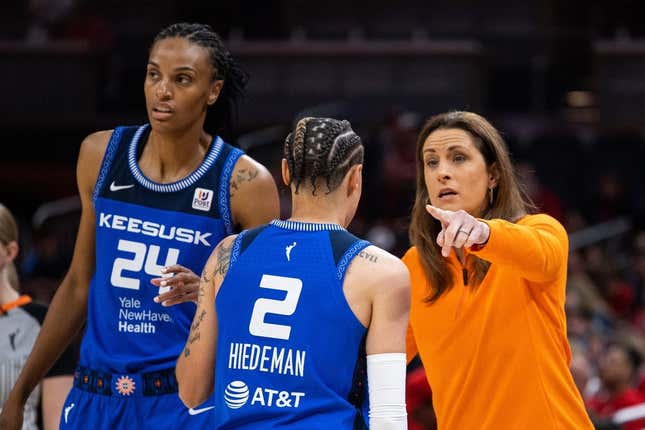 May 19, 2023; Indianapolis, Indiana, USA; Connecticut Sun head coach Stephanie White talks with guard Natisha Hiedeman (2) in the first half against the Indiana Fever at Gainbridge Fieldhouse.