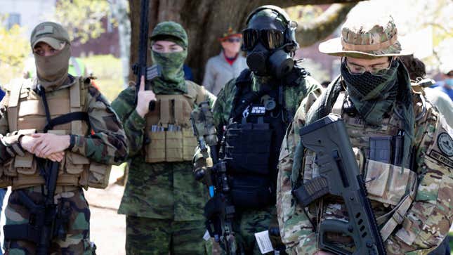 Heavily armed individuals, some associated with “Boogaloo,” protest coronavirus lockdowns in New Hampshire in May 2020.