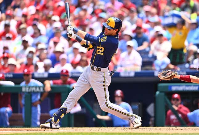Jul 20, 2023; Philadelphia, Pennsylvania, USA; Milwaukee Brewers outfielder Christian Yelich (22) hits a three-run home run against the Philadelphia Phillies in the third inning at Citizens Bank Park.