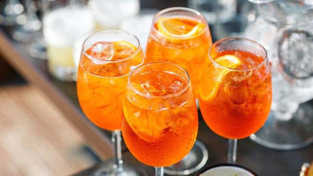 four glasses of aperol spritz signature cocktail at wedding reception