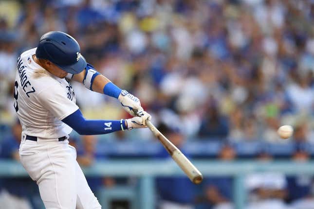 Aug 12, 2023; Los Angeles, California, USA; Los Angeles Dodgers shortstop Enrique Hernandez (8) doubles against the Colorado Rockies during the second inning at Dodger Stadium.