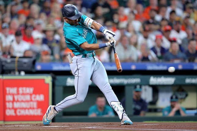 Aug 19, 2023; Houston, Texas, USA; Seattle Mariners center fielder Julio Rodriguez (44) hits a single against the Houston Astros during the first inning during the first inning at Minute Maid Park.