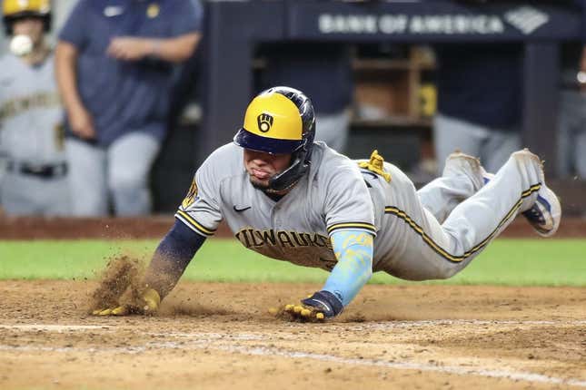 Sep 8, 2023; Bronx, New York, USA;  Milwaukee Brewers catcher William Contreras (24) slides safely at home in the seventh inning against the New York Yankees at Yankee Stadium.