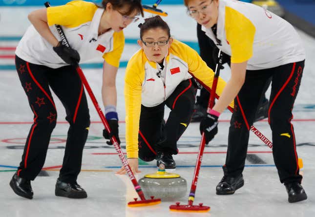 Curling - Pyeongchang 2018 Winter Olympics - Women's Round Robin - Sweden v China - Gangneung Curling Center - Gangneung, South Korea - February 21, 2018 - Wang Bingyu of China watches as team mates sweep. REUTERS/Phil Noble