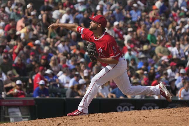 Mar 18, 2023; Tempe, Arizona, USA; Los Angeles Angels relief pitcher Ryan Tepera (52) throws against the Texas Rangers in the fifth inning at Tempe Diablo Stadium.