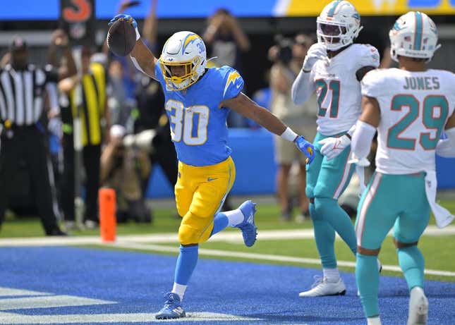 Sep 10, 2023; Inglewood, California, USA; Los Angeles Chargers running back Austin Ekeler (30) celebrates after a touchdown in the first half against the Miami Dolphins at SoFi Stadium.