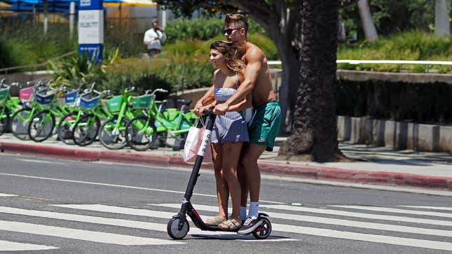 Image for article titled Report: You Will Never Find Love Like 2 Teens Sharing Electric Scooter