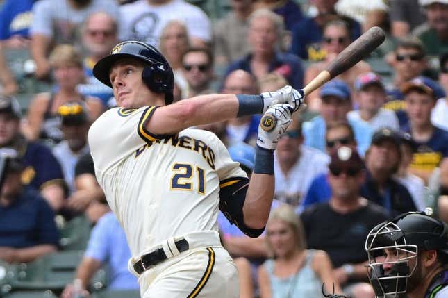 Aug 9, 2023; Milwaukee, Wisconsin, USA;  Milwaukee Brewers first baseman Mark Canha (21) hits a double to drive in a run in the tenth inning against the Colorado Rockies at American Family Field.