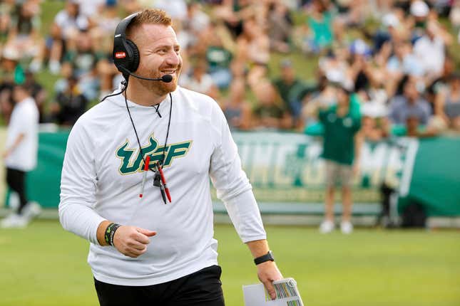 South Florida NCAA college football head coach Alex Golesh smiles during a spring scrimmage Friday, April 14, 2023, in Tampa, Fla. The University of South Florida is looking for some big changes when the Tampa school plans to open a new $340 million on-campus football stadium in 2026. The stadium is expected to seat about 35,000, far smaller than the 75,000 or so where the Bulls now play at Raymond James Stadium, home of the NFL&#39;s Tampa Bay Buccaneers. (Luis Santana/Tampa Bay Times via AP)