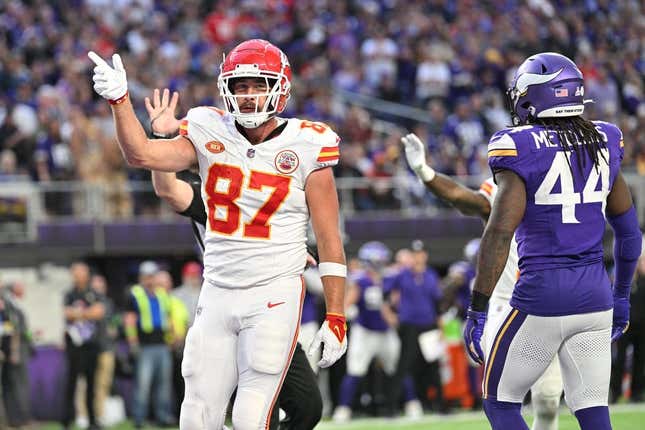 Kansas City Chiefs' Travis Kelce (87) walks the turf during the