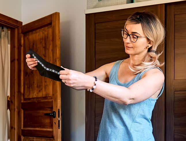Image for article titled ‘Since When Did Women’s Tops Get So Small?’ Says Mom Holding Up Sock