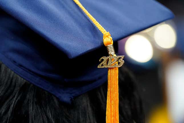 FILE - A tassel with 2023 on it rests on a graduation cap as students walk in a procession for Howard University&#39;s commencement in Washington, Saturday, May 13, 2023. The return of federal student loan payments in October has the potential to derail your finances, especially if you’re already struggling with credit card payments. (AP Photo/Alex Brandon, File)