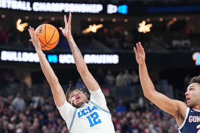Mar 23, 2023; Las Vegas, NV, USA; UCLA Bruins forward Mac Etienne (12) reaches for the ball against Gonzaga Bulldogs forward Anton Watson (22) during the second half at T-Mobile Arena.
