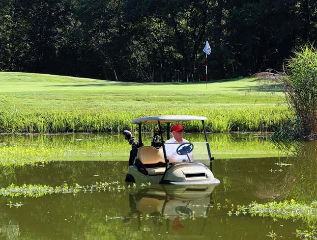 Image for article titled Despondent Trump Drives Golf Cart Into Water Hazard