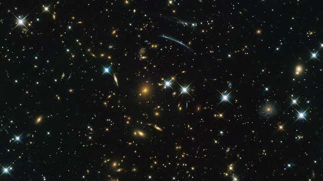 Hubble image of galaxy clusters and stars, including the PLCK G004.5-19.5 cluster discovered by Planck.