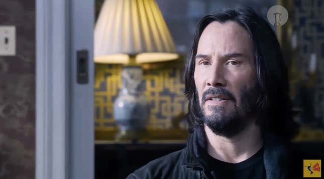 Keanu Reeves as Neo/Thomas looking dismayed at a therapy appointment in the trailer for Matrix Resurrections.