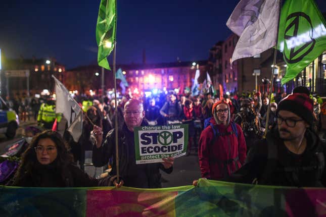 Protesters march during the U.N. Climate Summit on November 10, 2021 in Glasgow, United Kingdom.
