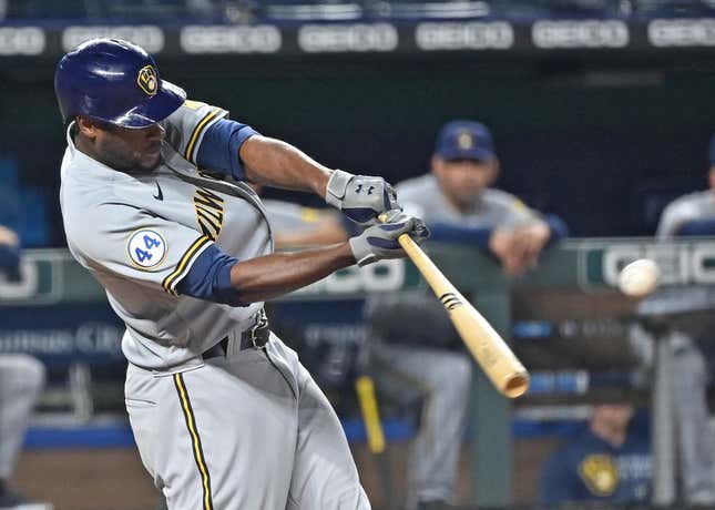 May 18, 2021; Kansas City, Missouri, USA; Milwaukee Brewers center fielder Lorenzo Cain (6) singles during the ninth inning against the Kansas City Royals at Kauffman Stadium.