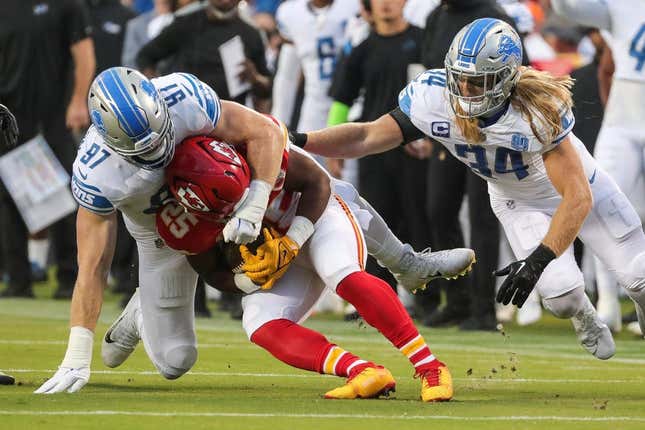 Detroit Lions defensive end Aidan Hutchinson (97) tackles ]Kansas City Chiefs running back Clyde Edwards-Helaire (25) during the first half at Arrowhead Stadium in Kansas City, Mo. on Thursday, Sept. 7, 2023.