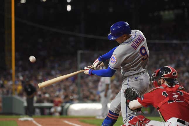 Jul 21, 2023; Boston, Massachusetts, USA;  New York Mets center fielder Brandon Nimmo (9) hits a two-run home run during the third inning against the Boston Red Sox at Fenway Park.