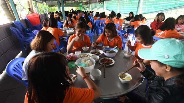 Students at a boarding school in Ho Chi Minh City eat lunch together