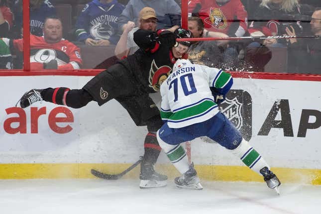 Nov 8, 2022; Ottawa, Ontario, CAN; Ottawa Senators defenseman Thomas Chabot (72) collides with Vancouver Canucks left wing Tanner Pearson (70) in the third period at the Canadian Tire Centre.