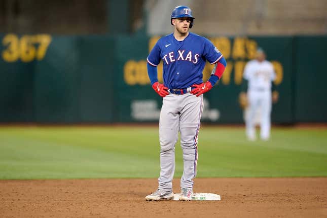 Aug 7, 2023; Oakland, California, USA; Texas Rangers catcher Mitch Garver (18) stands on second base after hitting his second double of the game against the Oakland Athletics during the sixth inning at Oakland-Alameda County Coliseum.