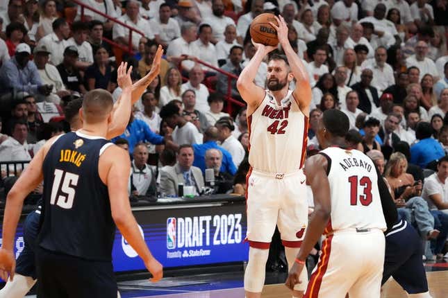 Jun 9, 2023; Miami, Florida, USA; Miami Heat forward Kevin Love (42) shoots the ball against the Denver Nuggets during the third quarter in game four of the 2023 NBA Finals at Kaseya Center.
