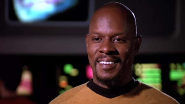 Benjamin Sisko smiles as he speaks to Captain Kirk in the climax of Star Trek: Deep Space Nine's 30th anniversary special, "Trials and Tribble-ations".