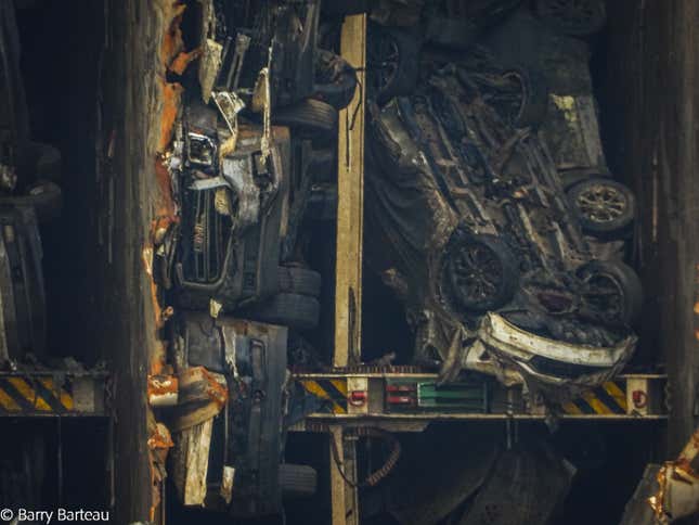 Image for article titled A Chain Just Cut Through A Capsized Cargo Ship Filled With Cars And The Process Is Fascinating (UPDATE W/VIDEO)