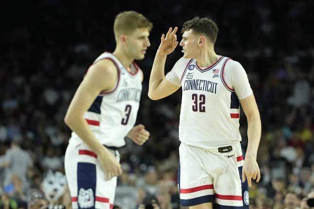 Apr 3, 2023; Houston, TX, USA; Connecticut Huskies center Donovan Clingan (32) reacts after a play against the San Diego State Aztecs during the first half in the national championship game of the 2023 NCAA Tournament at NRG Stadium.