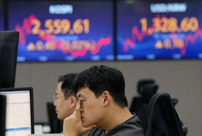 A currency trader watches monitors at the foreign exchange dealing room of the KEB Hana Bank headquarters in Seoul, South Korea, Wednesday, Sept. 20, 2023. Asian shares declined Wednesday as markets awaited a decision on interest rates by the Federal Reserve. (AP Photo/Ahn Young-joon)