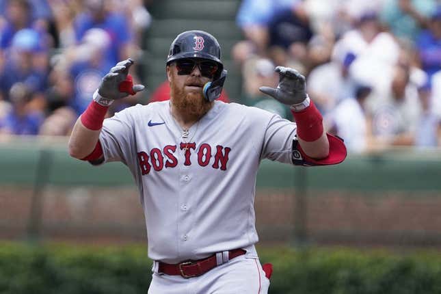 Jul 15, 2023; Chicago, Illinois, USA; Boston Red Sox designated hitter Justin Turner (2) gestures after hitting a double against the Chicago Cubs during the first inning at Wrigley Field.