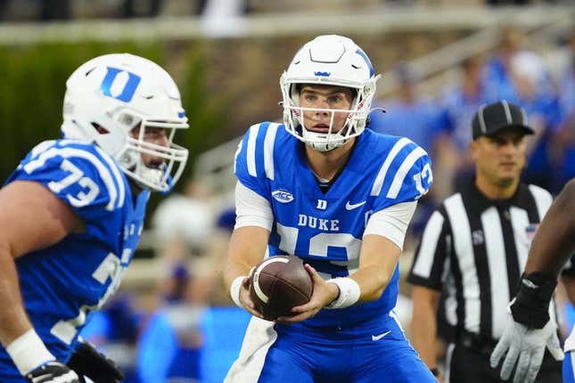 Sep 9, 2023; Durham, North Carolina, USA; Duke Blue Devils quarterback Riley Leonard (13) gets ready to hand the ball off against the Lafayette Leopards during the first half at Wallace Wade Stadium.