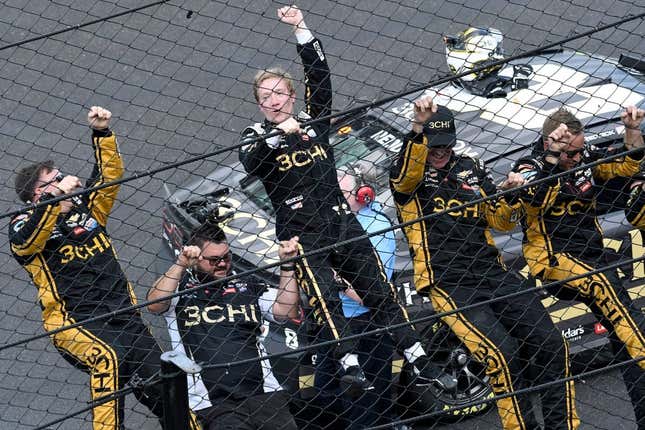 NASCAR Cup Series driver Tyler Reddick (8) and his team climb the fence Sunday, July 31, 2022, after winning the Verizon 200 at the Brickyard at Indianapolis Motor Speedway.

MAIN IMAGE 073122 Nascarverizon200 0027