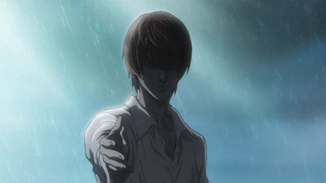 Light Yagami extends his hand while standing in the rain.