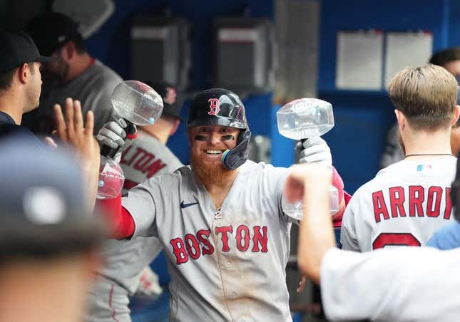 Justin Turner of the Boston Red Sox celebrates his two-run double