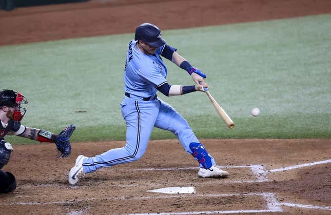 Jun 16, 2023; Arlington, Texas, USA; Toronto Blue Jays catcher Danny Jansen (9) hits a two-run home run during the fifth inning against the Texas Rangers at Globe Life Field.