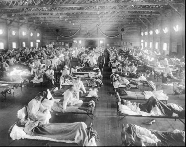 Influenza victims crowd into an emergency hospital at Camp Funston, a subdivision of Fort Riley in Kansas, in 1918.