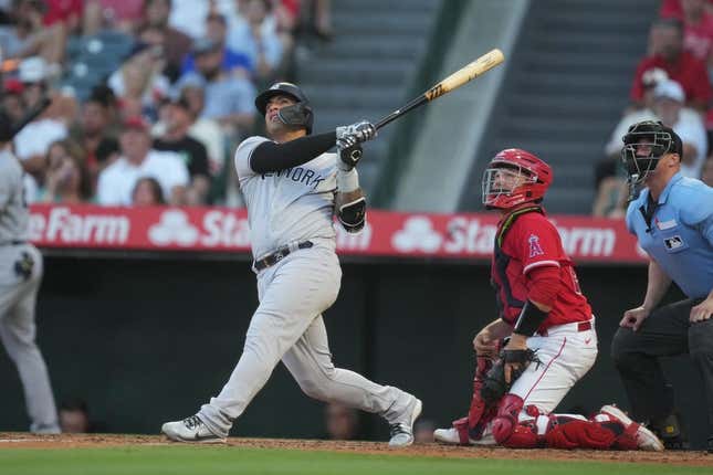 Jul 18, 2023; Anaheim, California, USA; New York Yankees second baseman Gleyber Torres (25) hits a home run in the second inning against the Los Angeles Angels at Angel Stadium.