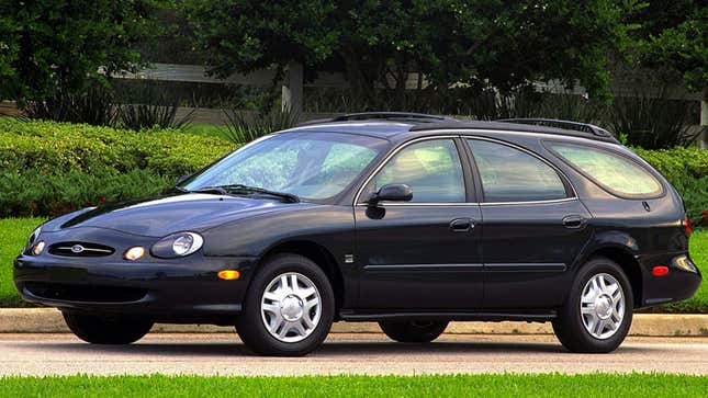 A photo of a black Ford Taurus wagon from 1996. 