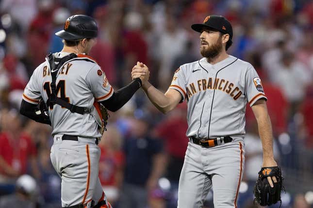 Aug 23, 2023; Philadelphia, Pennsylvania, USA; San Francisco Giants pitcher Ryan Walker (R) and catcher Patrick Bailey (14) shake hands after a victory against the Philadelphia Phillies at Citizens Bank Park.