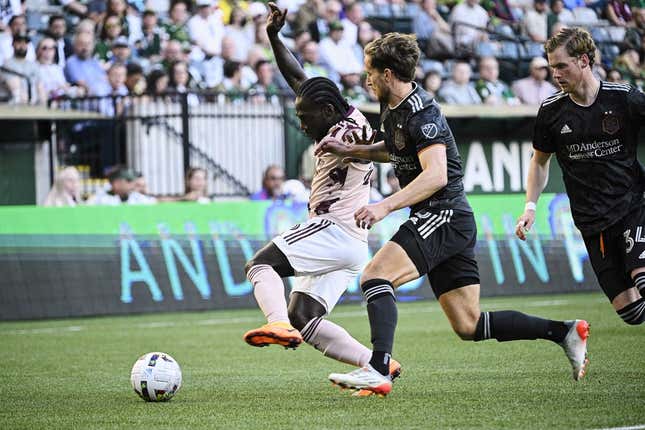 Jun 29, 2022; Portland, Oregon, USA; Houston Dynamo defender Adam Lundqvist (3) defends Portland Timbers forward Yimmi Chara (23) during the first half at Providence Park. The Timbers won 2-1.