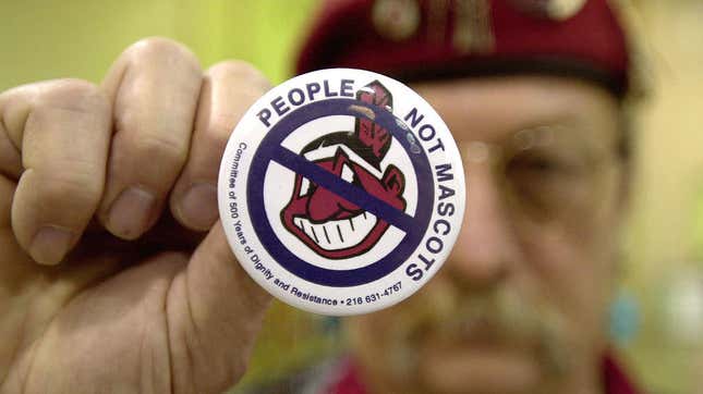 A man holds up an anti-mascot button to protest using Native Americans as mascots for sports teams at a 2003 event in Ohio. On May 16, 2019, the governor of Maine signed into law a bill banning the use of Native American imagery and symbols as mascots at all public schools and universities.
