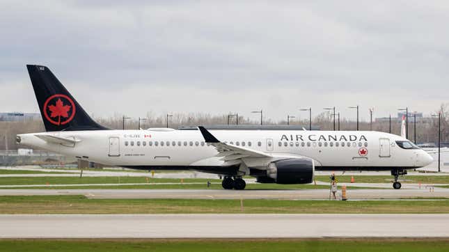 An Air Canada airplane taxis on the runway at Montreal-Pierre Elliott Trudeau International Airport (YUL) in Montreal, Quebec, Canada, on Wednesday, April 19, 2023.