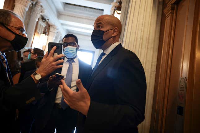 Sen. Cory Booker (D-NJ) speaks with a reporter before going to the Senate Chambers for a vote at the U.S. Capitol on September 21, 2021 in Washington, DC.