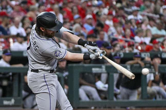Aug 4, 2023; St. Louis, Missouri, USA; Colorado Rockies second baseman Brendan Rodgers (7) hits a one run single against the St. Louis Cardinals during the second inning at Busch Stadium.