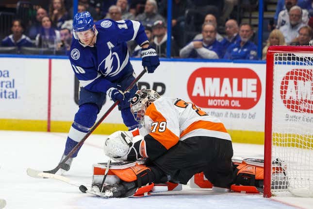 Mar 7, 2023; Tampa, Florida, USA; Tampa Bay Lightning right wing Corey Perry (10) shoots the puck on Philadelphia Flyers goaltender Carter Hart (79) in the first period at Amalie Arena.
