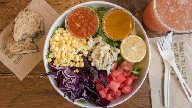 A Sweetgreen salad with corn, cabbage, tomatoes, and chicken